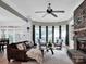 Inviting living room featuring a stone fireplace, and large windows at 2553 Fallbrook Nw Pl, Concord, NC 28027