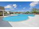 Large community pool, surrounded by lounge area and lush greenery, perfect for relaxation and recreation at 2573 Blue Sky Meadows Dr, Monroe, NC 28110