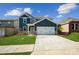 Beautiful two-story home with a two-car garage, well-manicured lawn and a charming exterior at 2573 Blue Sky Meadows Dr, Monroe, NC 28110