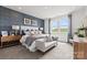 Comfortable main bedroom with large windows, stylish furnishings, and serene decor at 2573 Blue Sky Meadows Dr, Monroe, NC 28110