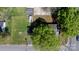 Aerial view of property featuring spacious backyard, mature trees, and multiple storage buildings at 2701 N Main Ave, Newton, NC 28658