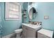 Stylish bathroom with modern fixtures and a circular mirror at 2701 N Main Ave, Newton, NC 28658