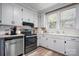 Functional kitchen with stainless steel appliances and ample cabinet space at 2701 N Main Ave, Newton, NC 28658