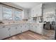 Well-lit kitchen with classic white cabinets and a connected dining area at 2701 N Main Ave, Newton, NC 28658