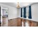 Spacious living room features hardwood floors and classic chandelier lighting at 2701 N Main Ave, Newton, NC 28658