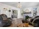 Cozy living room featuring a fireplace, hardwood floors, and neutral decor at 2701 N Main Ave, Newton, NC 28658