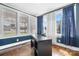 Well-lit home office space with large windows and dark desk at 2701 N Main Ave, Newton, NC 28658