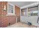 Enclosed back porch with brick wall and outdoor access at 2701 N Main Ave, Newton, NC 28658