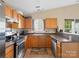Functional kitchen with stainless steel appliances, ample counter space, and wood cabinetry at 3005 Kansas City Dr, Monroe, NC 28110