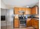 Well-equipped kitchen with stainless steel refrigerator, stove, and oven at 3005 Kansas City Dr, Monroe, NC 28110
