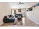 Spacious living room features neutral paint, tile floors, and ample natural light at 3005 Kansas City Dr, Monroe, NC 28110