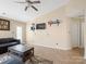 Cozy living room featuring a ceiling fan and a mounted TV at 3005 Kansas City Dr, Monroe, NC 28110