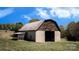 Rustic barn with weathered wood and concrete block construction at 3032 Mckinney Rd, Shelby, NC 28152