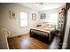 A bedroom with a queen size bed and laminate floors at 3032 Mckinney Rd, Shelby, NC 28152