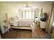 A bedroom with a large bed and hardwood floors at 3032 Mckinney Rd, Shelby, NC 28152