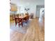 A dining room with wood table and rug and cow painting at 3032 Mckinney Rd, Shelby, NC 28152