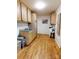 A laundry room with laminate flooring and storage at 3032 Mckinney Rd, Shelby, NC 28152