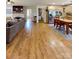 Spacious living room leading to the kitchen and dining area with fireplace at 3032 Mckinney Rd, Shelby, NC 28152