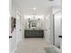 Bathroom with double sink vanity and a glass-enclosed tile shower at 3041 Winged Teal Ct, Belmont, NC 28012