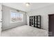 Bright bedroom with a large window and a modern bookshelf at 3041 Winged Teal Ct, Belmont, NC 28012