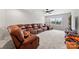 Spacious bonus room with carpeting, ceiling fan and plush leather seating at 3041 Winged Teal Ct, Belmont, NC 28012
