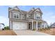 Charming two-story home with a welcoming front porch and a two-car garage, great curb appeal at 3041 Winged Teal Ct, Belmont, NC 28012
