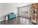 Well-lit flex room with hardwood floors, vintage record player and built-in shelving at 3041 Winged Teal Ct, Belmont, NC 28012