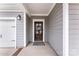 Close up of Front Door with wreath, siding, and hardware details at 3041 Winged Teal Ct, Belmont, NC 28012