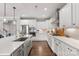 Bright kitchen featuring white cabinetry, stainless appliances, gas cooktop, and quartz countertops at 3041 Winged Teal Ct, Belmont, NC 28012