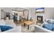 Living area with fireplace adjacent to open kitchen and hardwood floors at 3041 Winged Teal Ct, Belmont, NC 28012