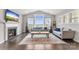 Bright living room with large windows, fireplace and hardwood floors at 3041 Winged Teal Ct, Belmont, NC 28012