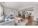 Open floor plan with living room, kitchen and dining areas and hardwood floors at 3041 Winged Teal Ct, Belmont, NC 28012