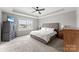 Bright main bedroom with neutral décor and large window with neighborhood views at 3041 Winged Teal Ct, Belmont, NC 28012