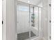 Glass-enclosed shower with white subway tile, a built-in bench, and a window at 3041 Winged Teal Ct, Belmont, NC 28012