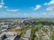 Expansive aerial view capturing the cityscape skyline against a bright blue sky with scattered clouds at 3510 Conway Ave, Charlotte, NC 28209