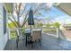 Outdoor back deck with table, umbrella and seating, offering a relaxing space at 3510 Conway Ave, Charlotte, NC 28209
