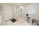 Modern bathroom with glass-enclosed shower, white tile, and stylish accents at 3510 Conway Ave, Charlotte, NC 28209