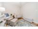 Bedroom features a white crib, rocking chair, and soft patterned rug at 3510 Conway Ave, Charlotte, NC 28209