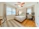 Bright bedroom with hardwood floors, natural light, and a dedicated workspace at 3510 Conway Ave, Charlotte, NC 28209