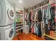 Walk-in closet with ample storage, shelving, washer and dryer at 3510 Conway Ave, Charlotte, NC 28209
