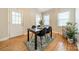 Cozy dining area with modern table set, rug, and a door to the outside at 3510 Conway Ave, Charlotte, NC 28209