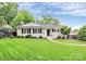 Charming home with manicured lawn, sidewalk, flowerbeds, and an inviting entrance at 3510 Conway Ave, Charlotte, NC 28209