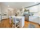 Bright kitchen with island, stainless steel appliances, and hardwood floors at 3510 Conway Ave, Charlotte, NC 28209