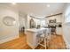 Modern kitchen with center island, stainless steel appliances, and hardwood flooring at 3510 Conway Ave, Charlotte, NC 28209