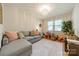 Cozy living room with a neutral color palette, stylish chandelier, and natural light at 3510 Conway Ave, Charlotte, NC 28209