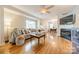 Bright living room boasts hardwood floors, fireplace, and comfortable seating area at 3510 Conway Ave, Charlotte, NC 28209