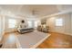 Spacious main bedroom featuring tray ceiling, hardwood floors, and natural light at 3510 Conway Ave, Charlotte, NC 28209