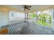 Covered porch features a grey floor, string lights and white railing at 3510 Conway Ave, Charlotte, NC 28209