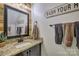 Rustic bathroom with decorative mirrors, a granite countertop, and a vessel sink for modern comfort at 4011 Fenworth Ct, Fort Mill, SC 29715