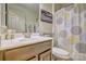 Cozy bathroom featuring a vanity with decorative wall art and patterned shower curtain and great natural light at 4011 Fenworth Ct, Fort Mill, SC 29715
